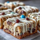 Vibrant Graduation Cookie Bars with white chocolate drizzle and colorful candy toppings, perfect for celebrating academic achievements.