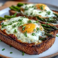 Fresh asparagus and creamy egg tartines with crisp toast, perfect for a quick spring brunch or light lunch.
